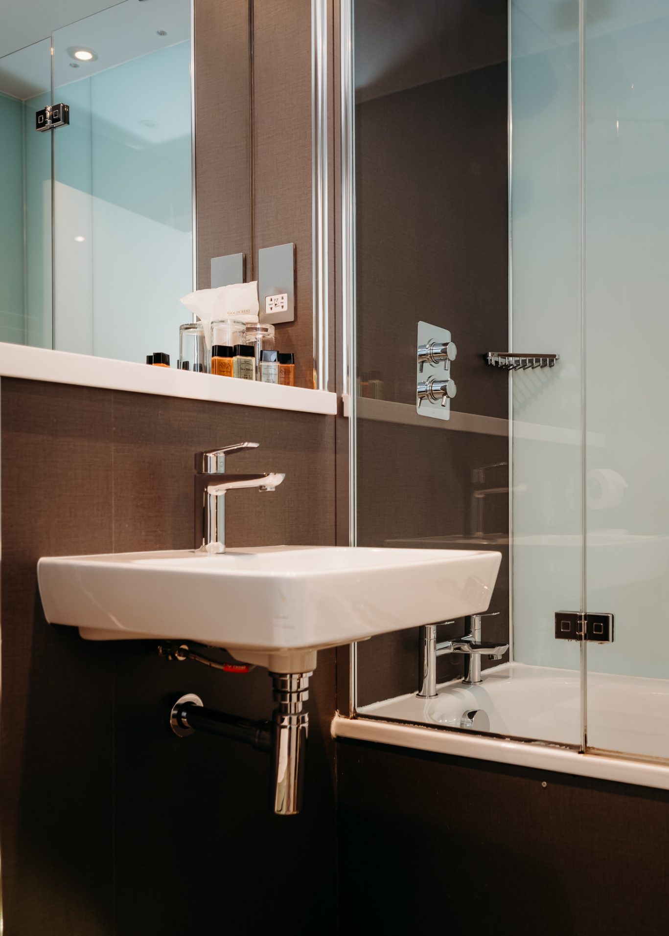modern bathroom with short sink and large mirror