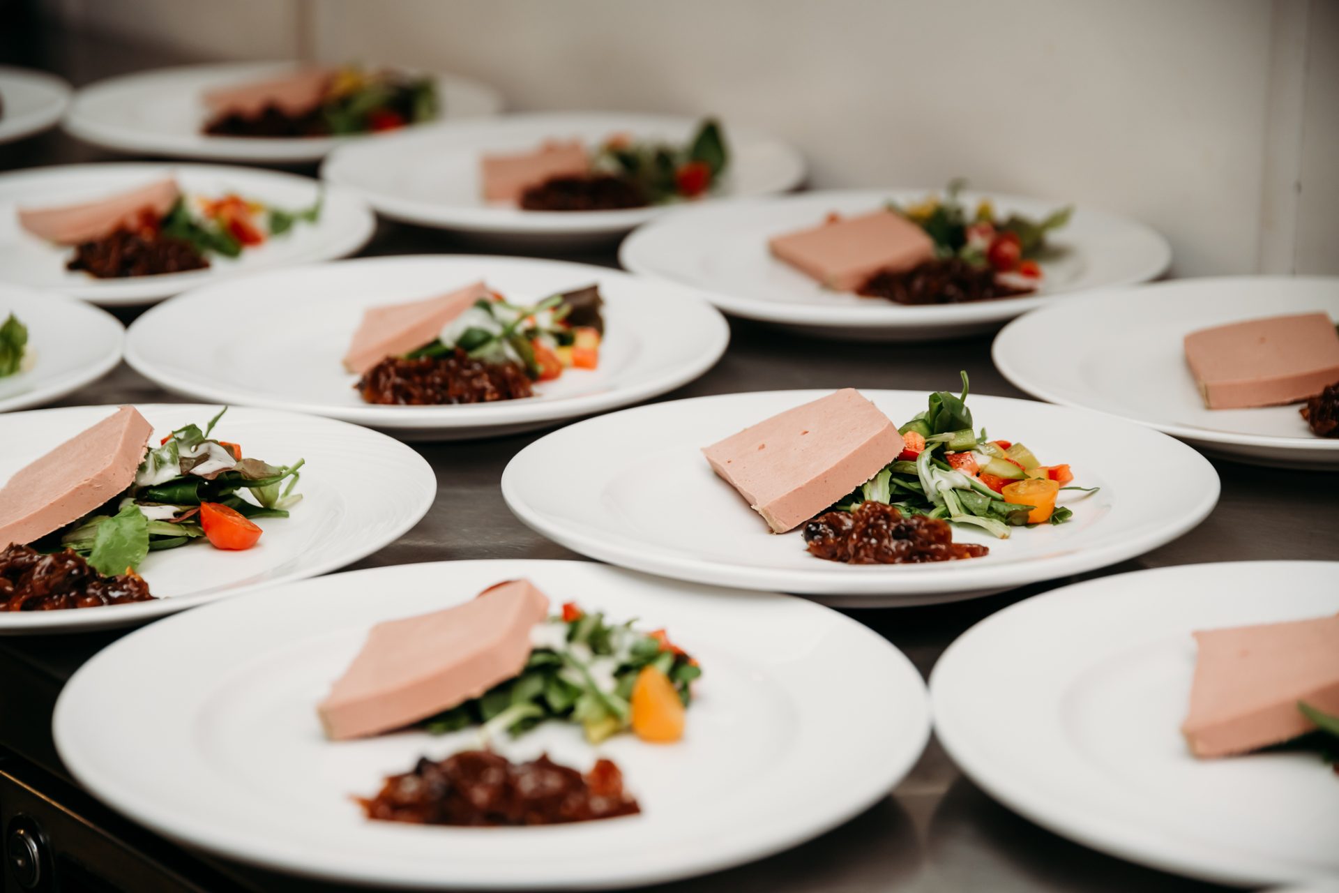 lots of plates filled with a salad and paté