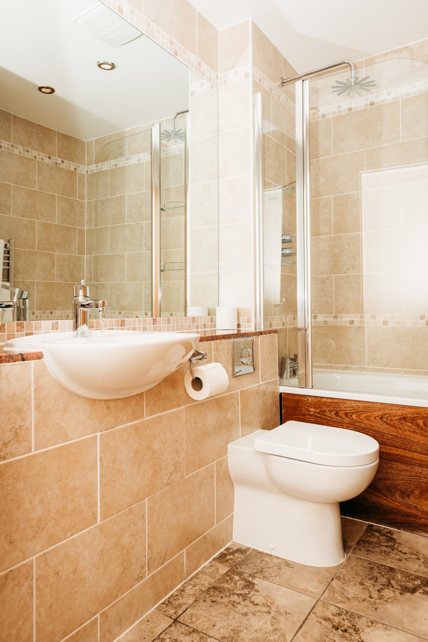 Red Hall Hotel bathroom with cream tiles and large mirror