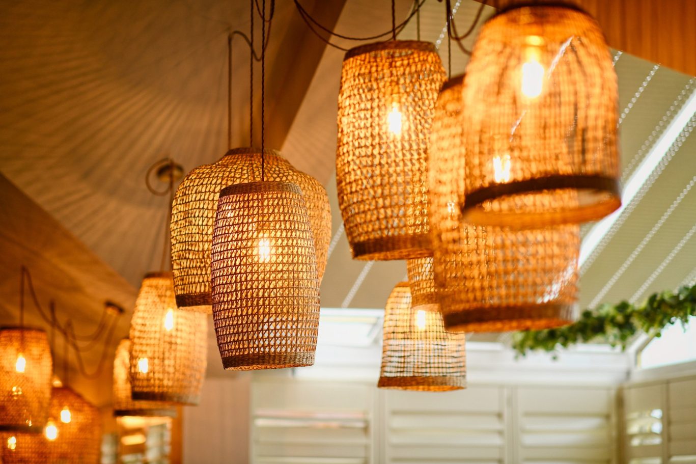 wicker lights hanging at the top of the restaurant different sizes and shapes at melange restaurant